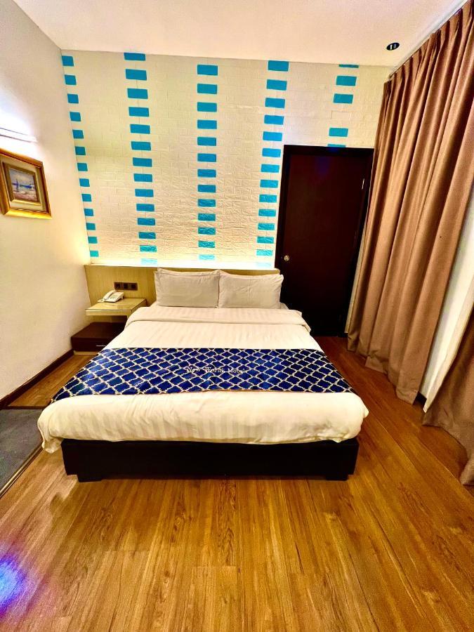 New World Express Motel บินตูลู ภายนอก รูปภาพ